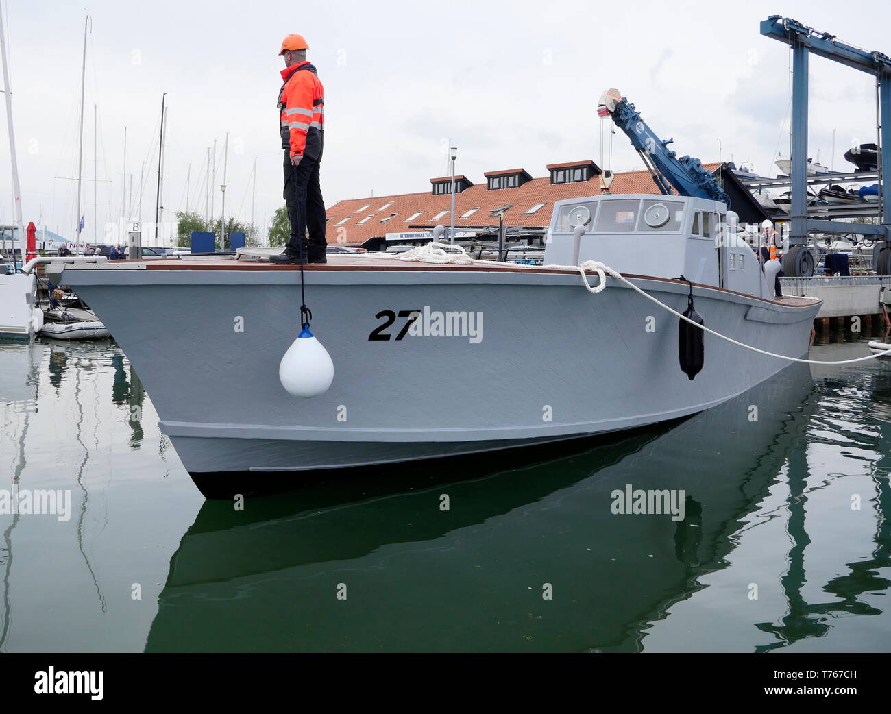 AJAXNETPHOTO.  3rd May, 2019. Hamble, England. - MA/SB 27 Re-launched - 78 years after being commissioned into the Royal Navy in 1941, the World War II Motor Anti-submarine Boat (MA/SB) 27,  is re-launched at Hamble Point Marina at the end of a three year restoration by owners D-Day Revisited Charity. The 63ft (18m) ex-Coastal Forces boat, originally built by the British Powerboat Co. at Hythe on Southampton Water in 1940-41 was one of a batch of Coastal Forces MA/SB boats numbered 22-36. MA/SB 27 served  throughout WWII first as a MA/SB and later, while operating out of Dartmouth on Naval Air Stock Photo