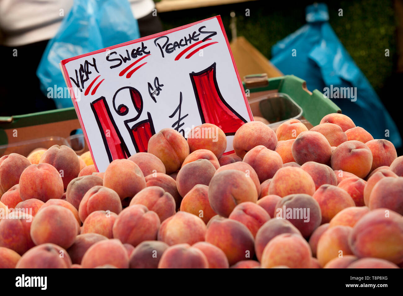 Peaches on a market stall Stock Photo