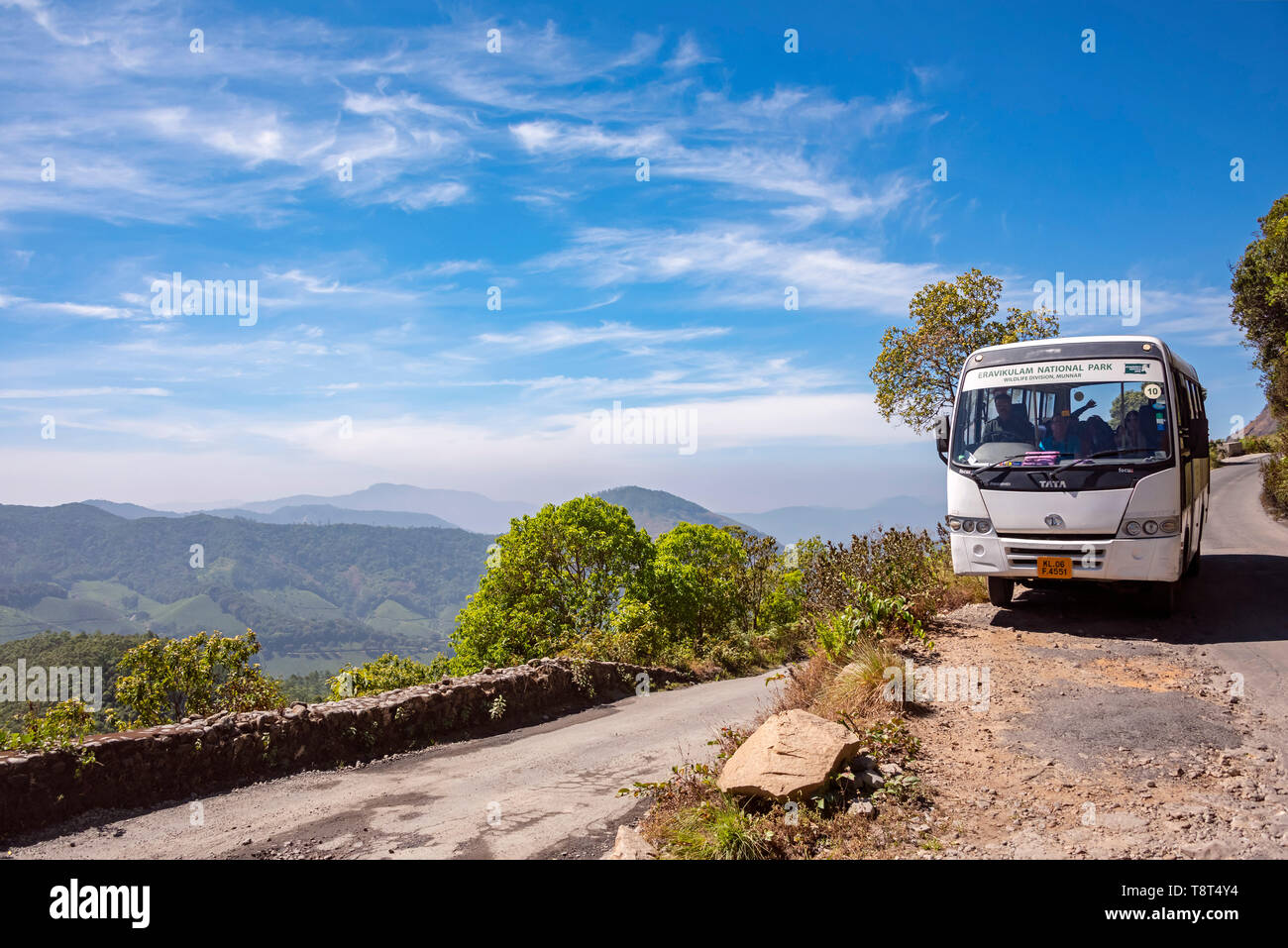 Horizontal view of a coach transporting people around Eravikulam National Park in Munnar, India. Stock Photo