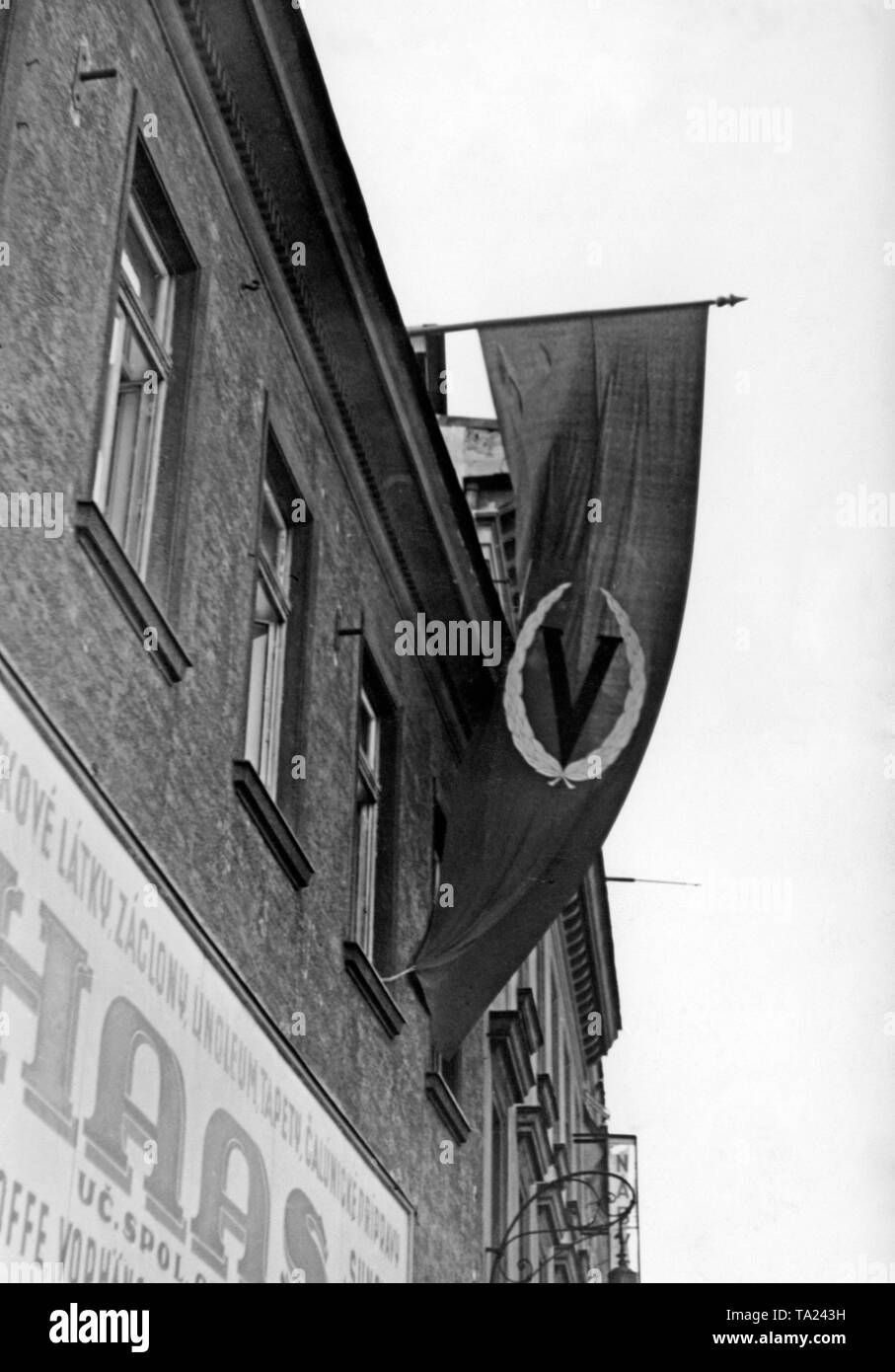 Banner with a 'V' and a laurel wreath in Bratislava. The 'V' is a symbol of Nazi victory. Stock Photo