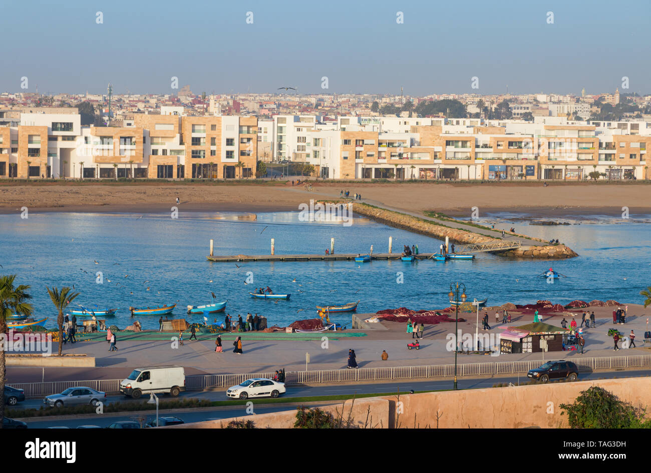 Bou Regreg river and the Avenue al Marsa with on the other side the city Sale with modern luxury apartments on a sunny evening. Rabat, Morocco. Stock Photo