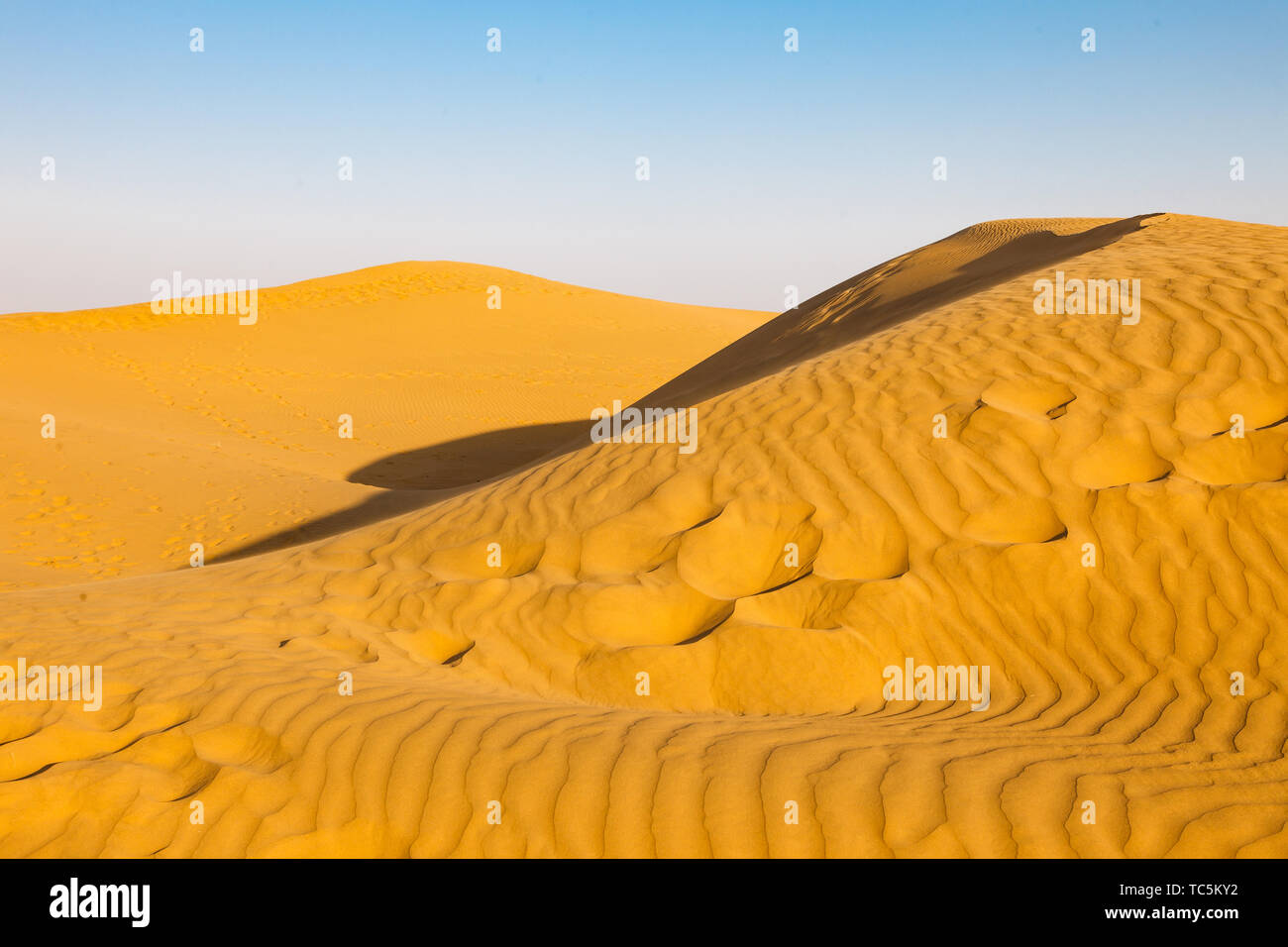 Sand dunes at sunset Stock Photo