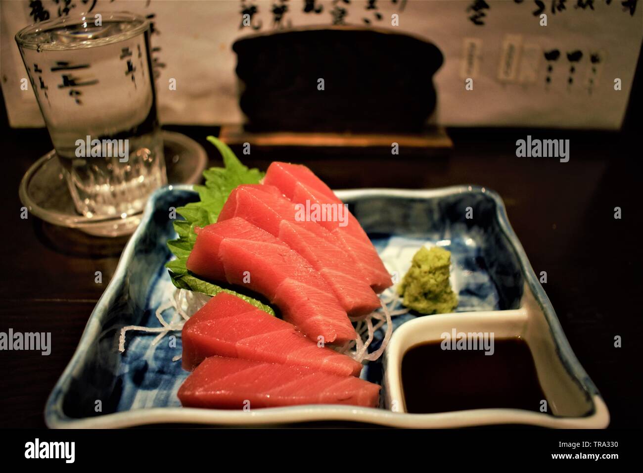 Maguro Sashimi with Sake at an Izakaya, Sapporo, Japan Stock Photo