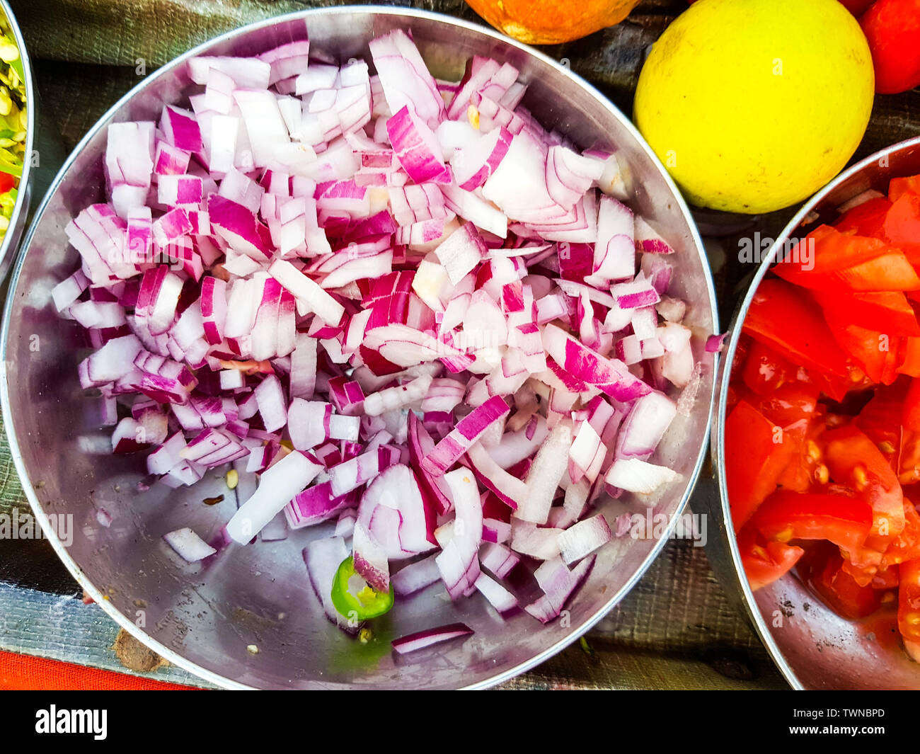 finely minced onion in a steel bowl Stock Photo