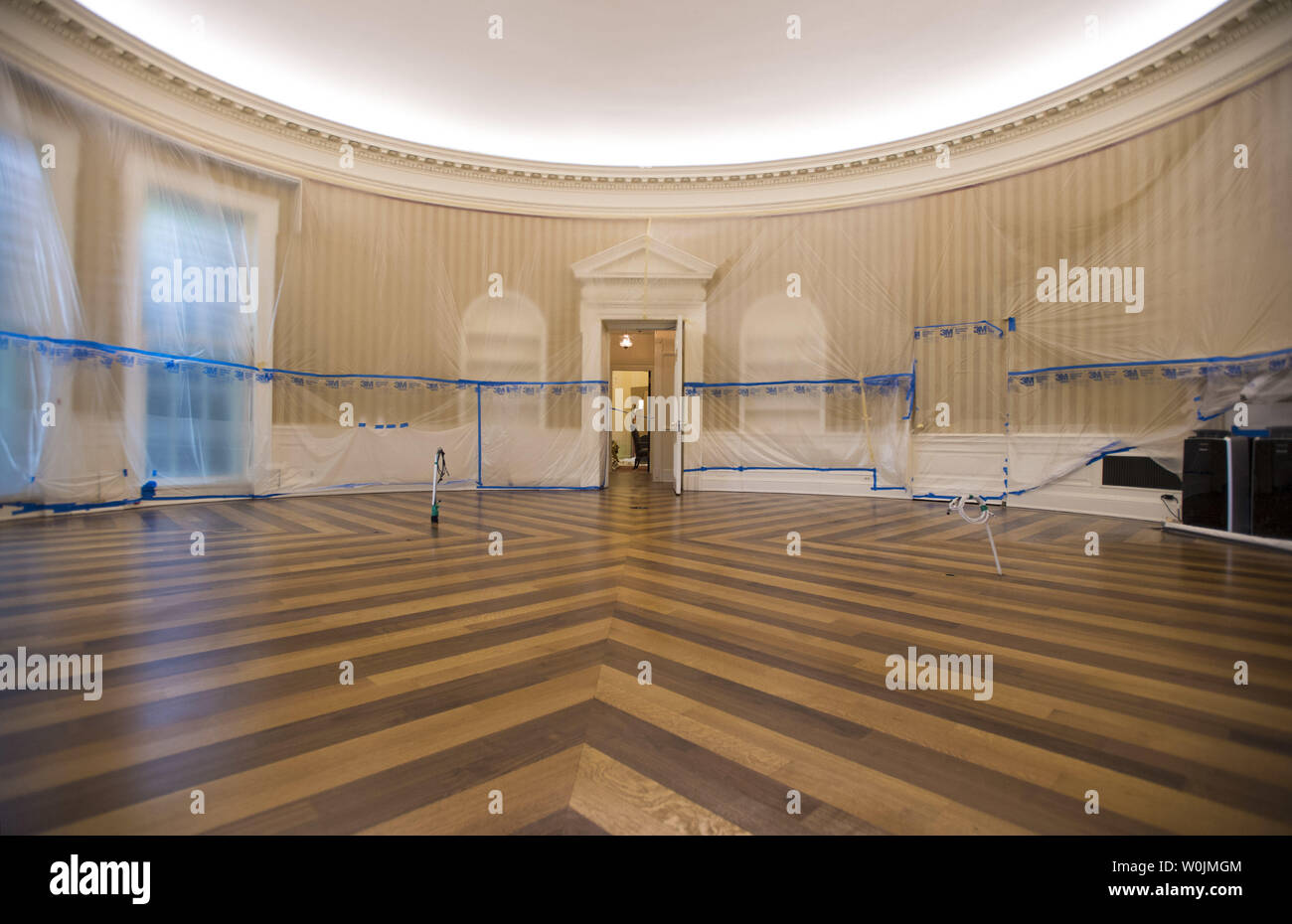 The Oval Office is seen emptied and covered in plastic as renovations are underway at the White House, in Washington, D.C. on August 11, 2017. While President Trump is in New Jersey on a 17-day vacation workers are updating and repairing the West Wing, including structural repairs, IT and HVAC improvements and generic cosmetic upgrades. Photo by Kevin Dietsch/UPI Stock Photo