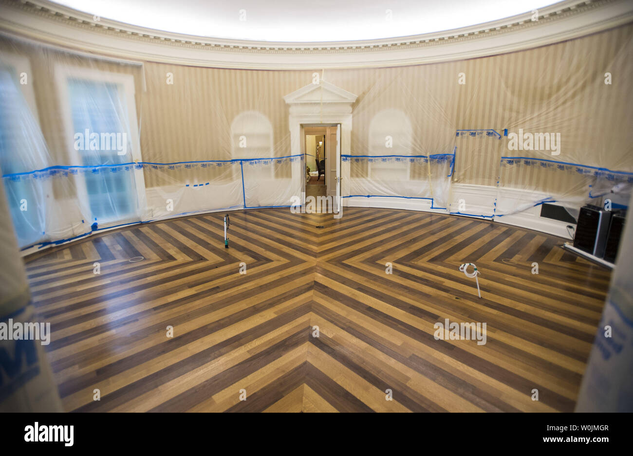 The Oval Office is seen emptied and covered in plastic as renovations are underway at the White House, in Washington, D.C. on August 11, 2017. While President Trump is in New Jersey on a 17-day vacation workers are updating and repairing the West Wing, including structural repairs, IT and HVAC improvements and generic cosmetic upgrades. Photo by Kevin Dietsch/UPI Stock Photo