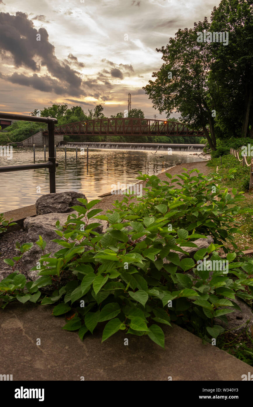 Man-made Waterfall on Mohawk River at Bellamy Harbor Park, Rome, New York (vertical) Stock Photo