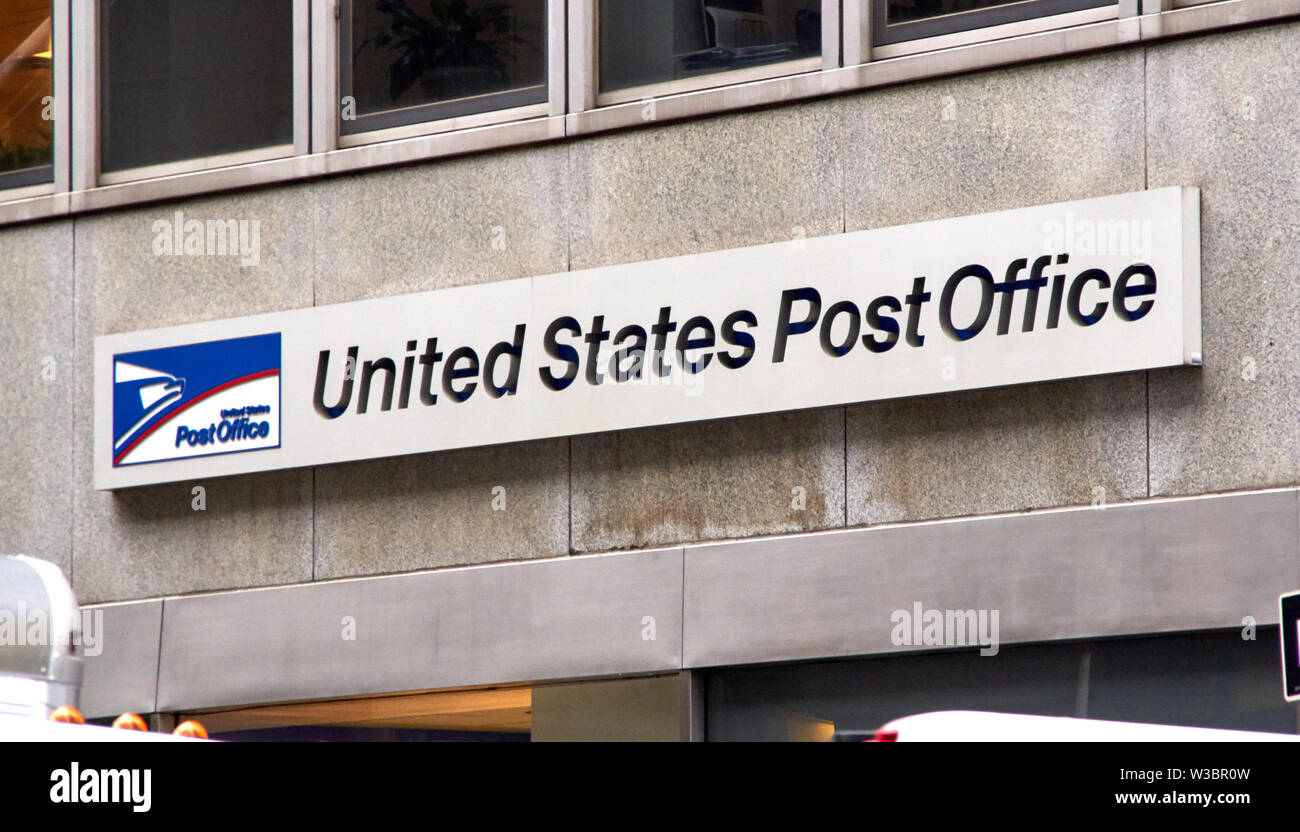 NEW YORK, USA - DECEMBER 14, 2018: Logo and signage of USPS on a wall. United States Postal Service is an independent agenc of US federal government r Stock Photo