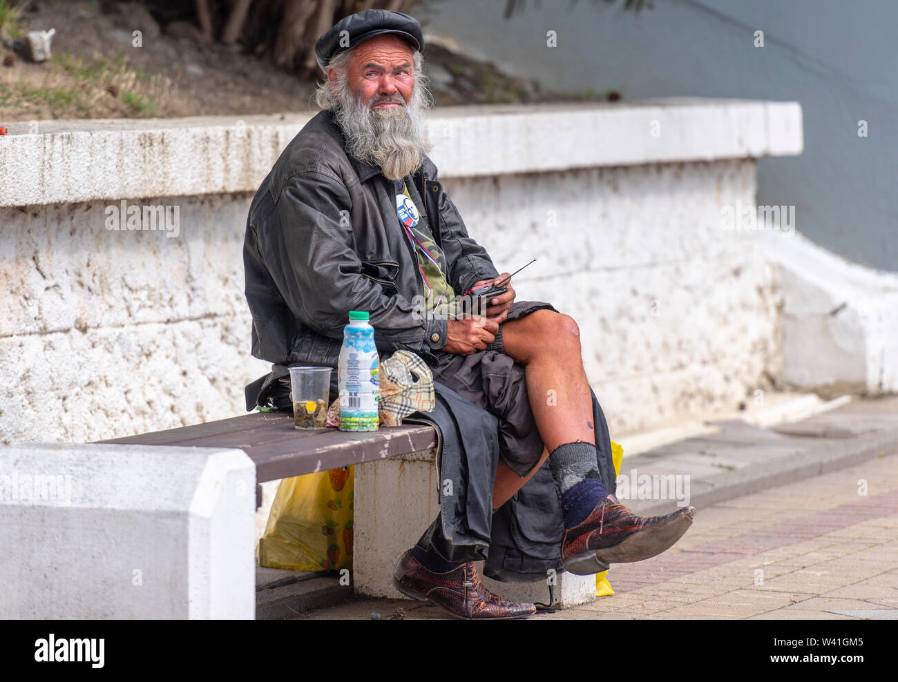 BEGGAR HOMELESS POOR MAN IN A STREET IN SOCHI IN RUSSIA Stock Photo