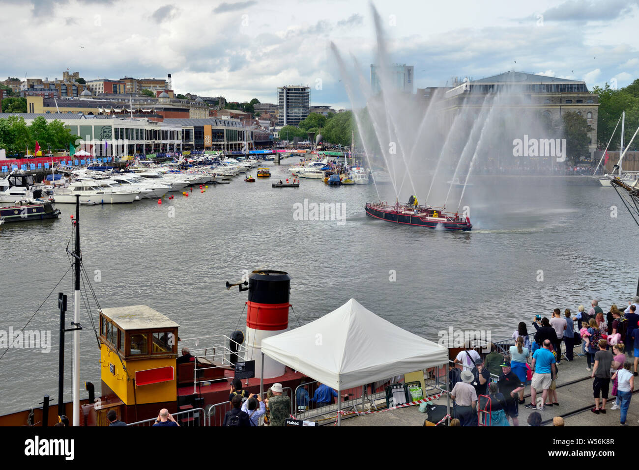 The old Pyronaut fire fighting boat giving demonstration of it powerful water cannon in Bristol harbour Stock Photo