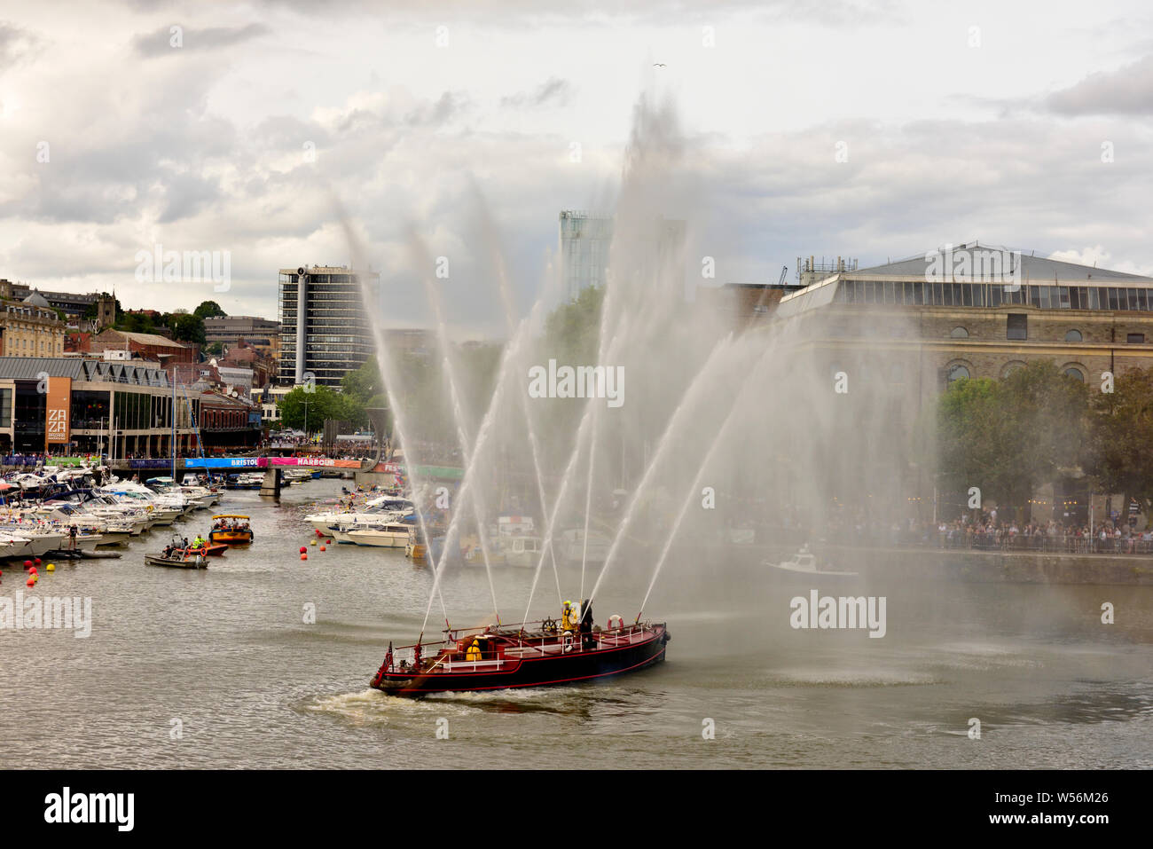 The old Pyronaut fire fighting boat giving demonstration of it powerful water cannon in Bristol harbour Stock Photo