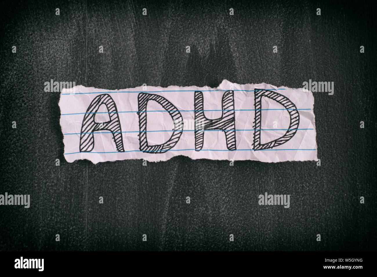 ADHD. Abbreviation ADHD on black background. Close up. ADHD is Attention deficit hyperactivity disorder. Stock Photo