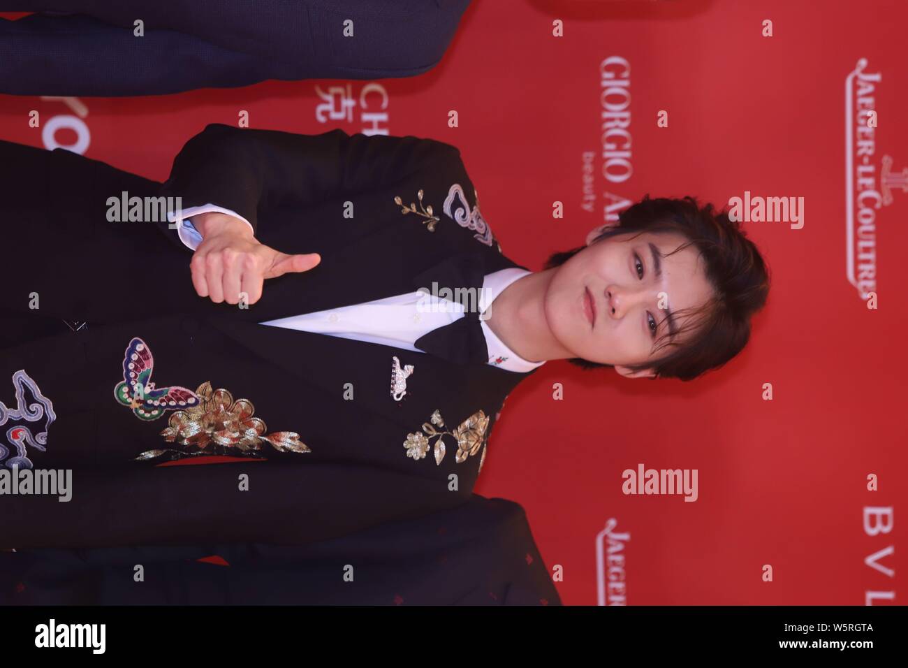 Chinese singer and actor Lu Han arrives on the red carpet for the opening ceremony of the 22nd Shanghai International Film Festival (SIFF 2019) in Sha Stock Photo