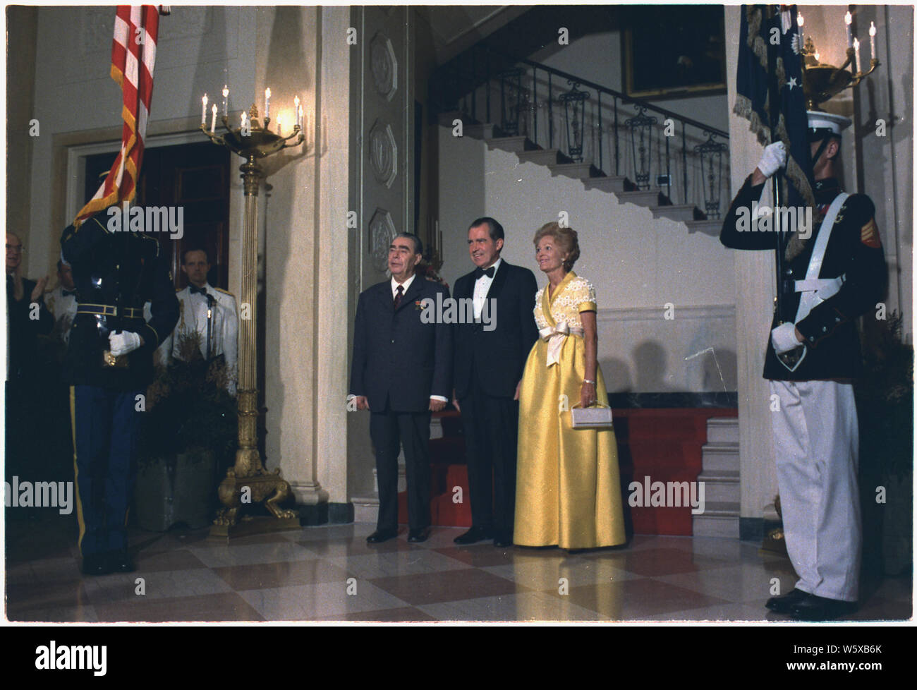 President and Mrs. Nixon and General Secretary Leonid Brezhnev of the Central Committee of the Communist Party of the Union of Soviet Socialist Republics enroute to the Blue Room, to receive dinner guests; Scope and content:  Pictured: Leonid Brezhnev, Richard M. Nixon, Thelma Ryan (Pat) Nixon. Subject: Heads of State - U.S.S.R. Stock Photo