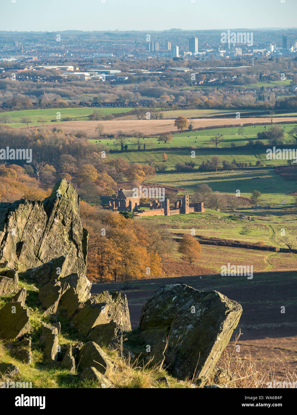 A distant view of Leicester and the ruins of Lady Jane Grey's House as seen from a rocky hilltop in Bradgate Park, Leicestershire, England, UK Stock Photo