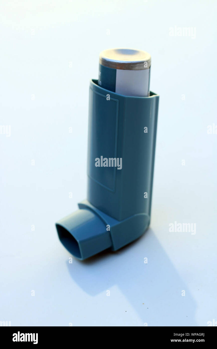 Medicine and health concept: Blue inhaler on a white background ... image.