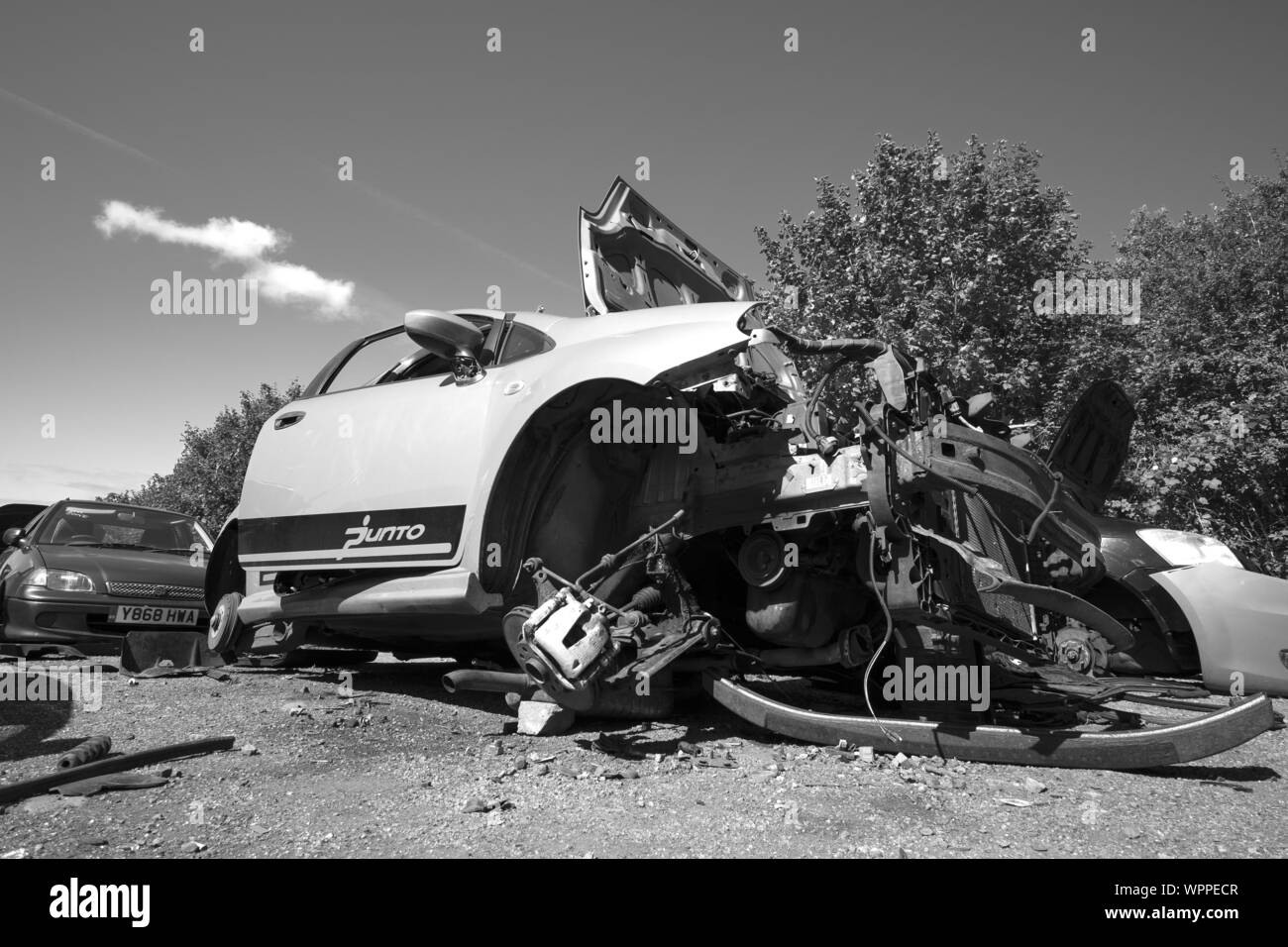 Smashed and wrecked car in a scrap yard Stock Photo