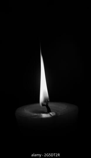 lighting candles, Burning candle on black background, Candle in the dark,  Design for the background and wallpaper. copy space Stock Photo - Alamy