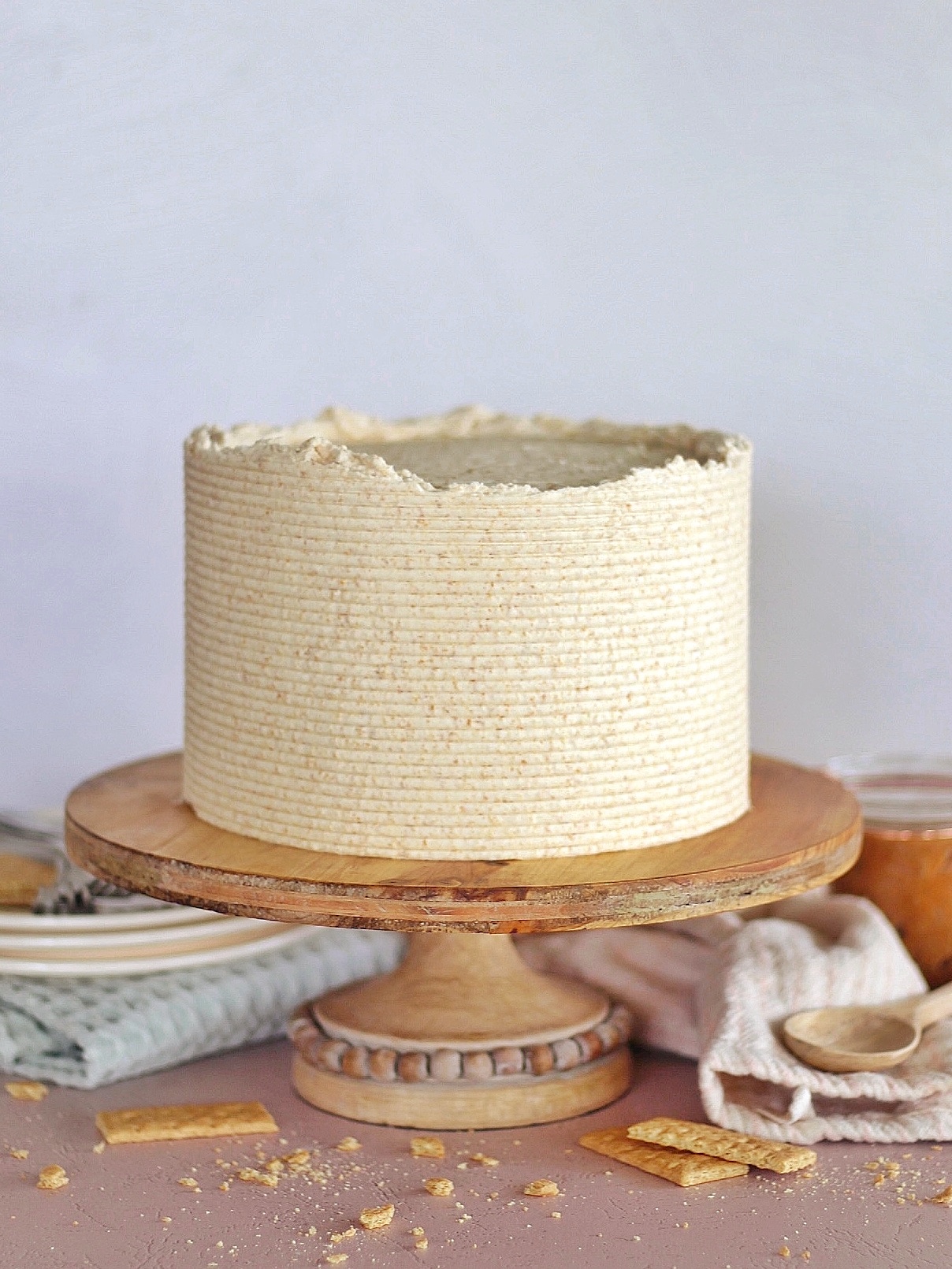 Graham Slam Cake - graham cracker cake layers baked on a graham cracker crust with graham cracker butter swirled in vanilla buttercream, covered in graham cracker buttercream. #cakebycourtney #grahamcracker #grahamcrackerdessert #grahamcrackercake #grahamcrackerbuttercream #cookiebutter #grahamcrackerbutter #buttercreamrecipe #cakerecipe #buttercream #howtomakebuttercreamfrosting #howtomakecake #cakeforbirthday #homemadefrosting #icingrecipe #homemadecakerecipe #howtocakeit #howtobakeacake #howtobake #dessert #dessertideas #cakeideas