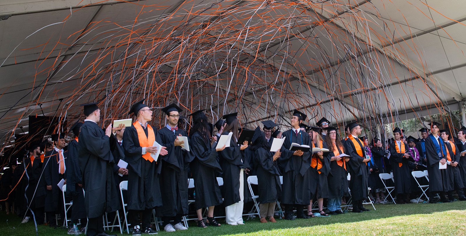 Confetti falls on the graduating class of 2024 at Commencement