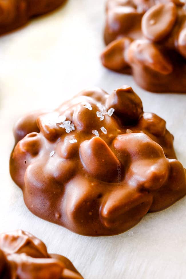 FOOL PROOF Crockpot Chocolate Peanut Clusters are not only crazy delicious but are SO easy!  They make the best make ahead, stress free gifts!  This post also includes tips and tricks to make them successful every time!