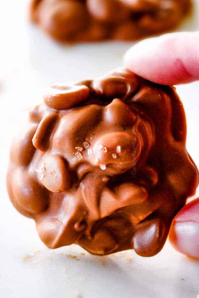 FOOL PROOF Crockpot Chocolate Peanut Clusters are not only crazy delicious but are SO easy!  They make the best make ahead, stress free gifts!  This post also includes tips and tricks to make them successful every time!