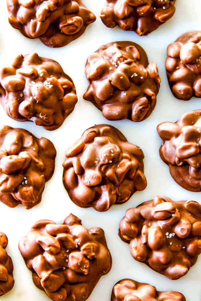 FOOL PROOF Crockpot Chocolate Peanut Clusters are not only crazy delicious but are SO easy!  They make the best make ahead, stress free gifts!  This post also includes tips and tricks to make them successful every time!