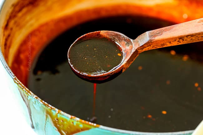 showing how  to make Korean Chicken Wings by making Korean BBQ Sauce by simmering soy sauce, sugar, rice wine and gochujang together in a saucepan