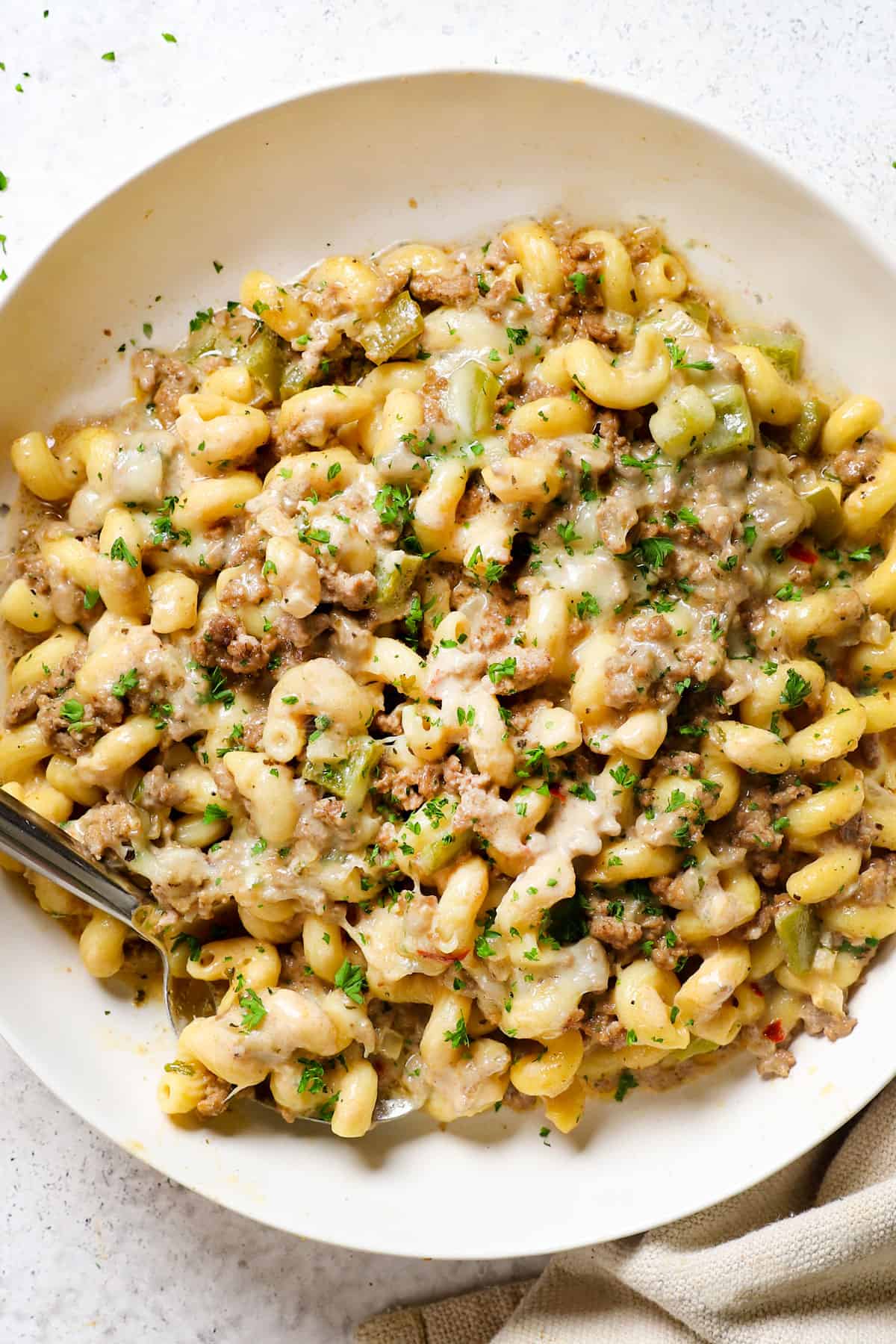 top view showing how to serve ground beef pasta Philly Cheesesteak style in a creamy sauce