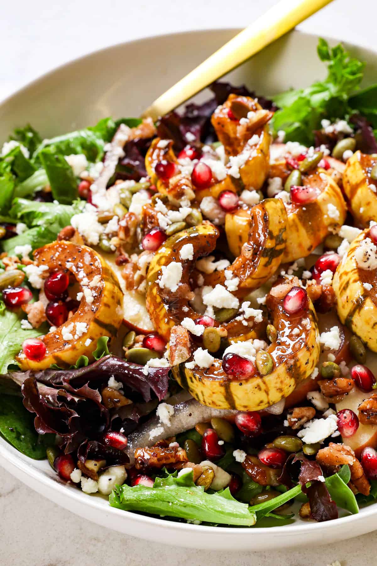 showing how to serve winter salad with squash on a plate