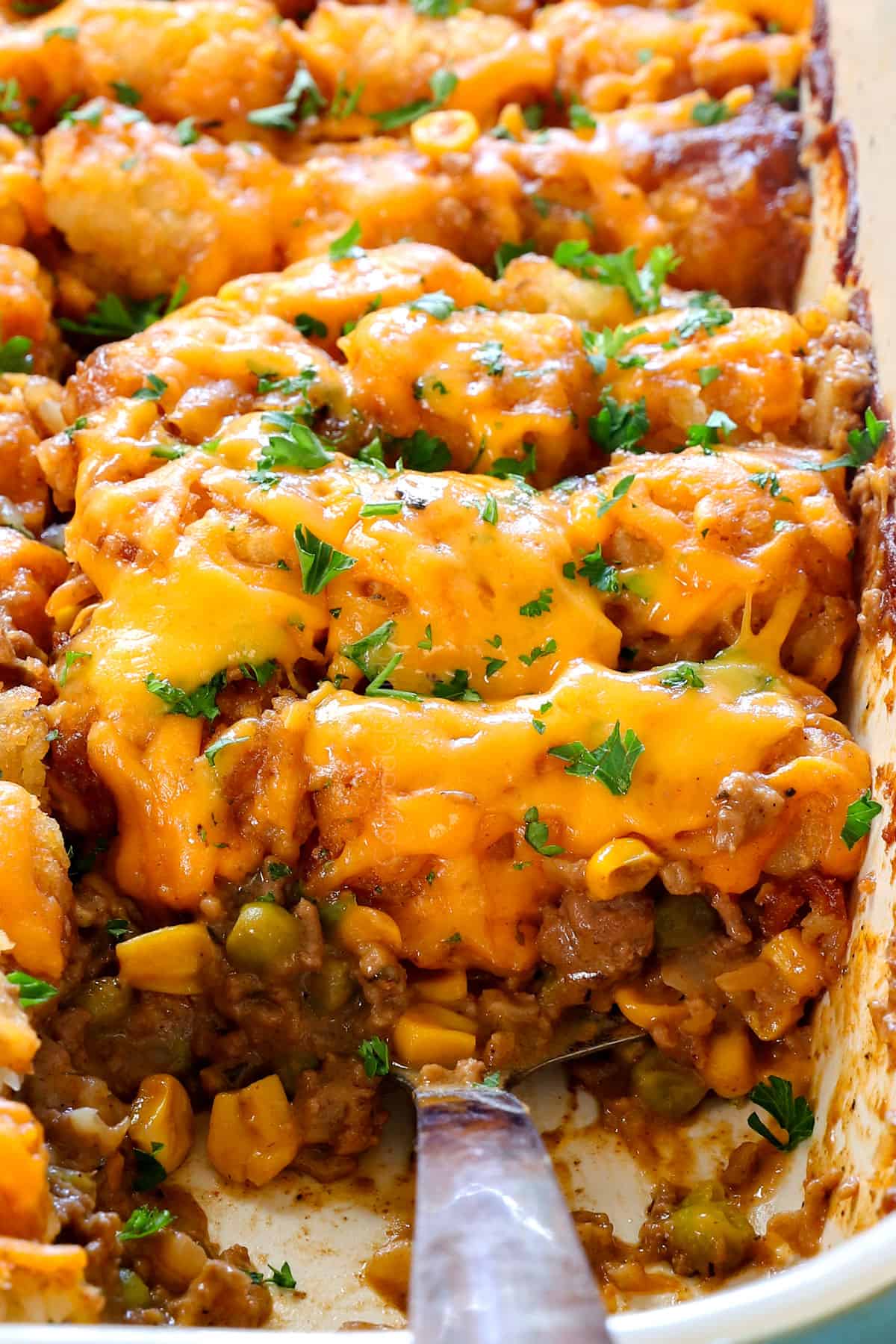 up close of cheesy tater tot casserole showing how cheesy it is