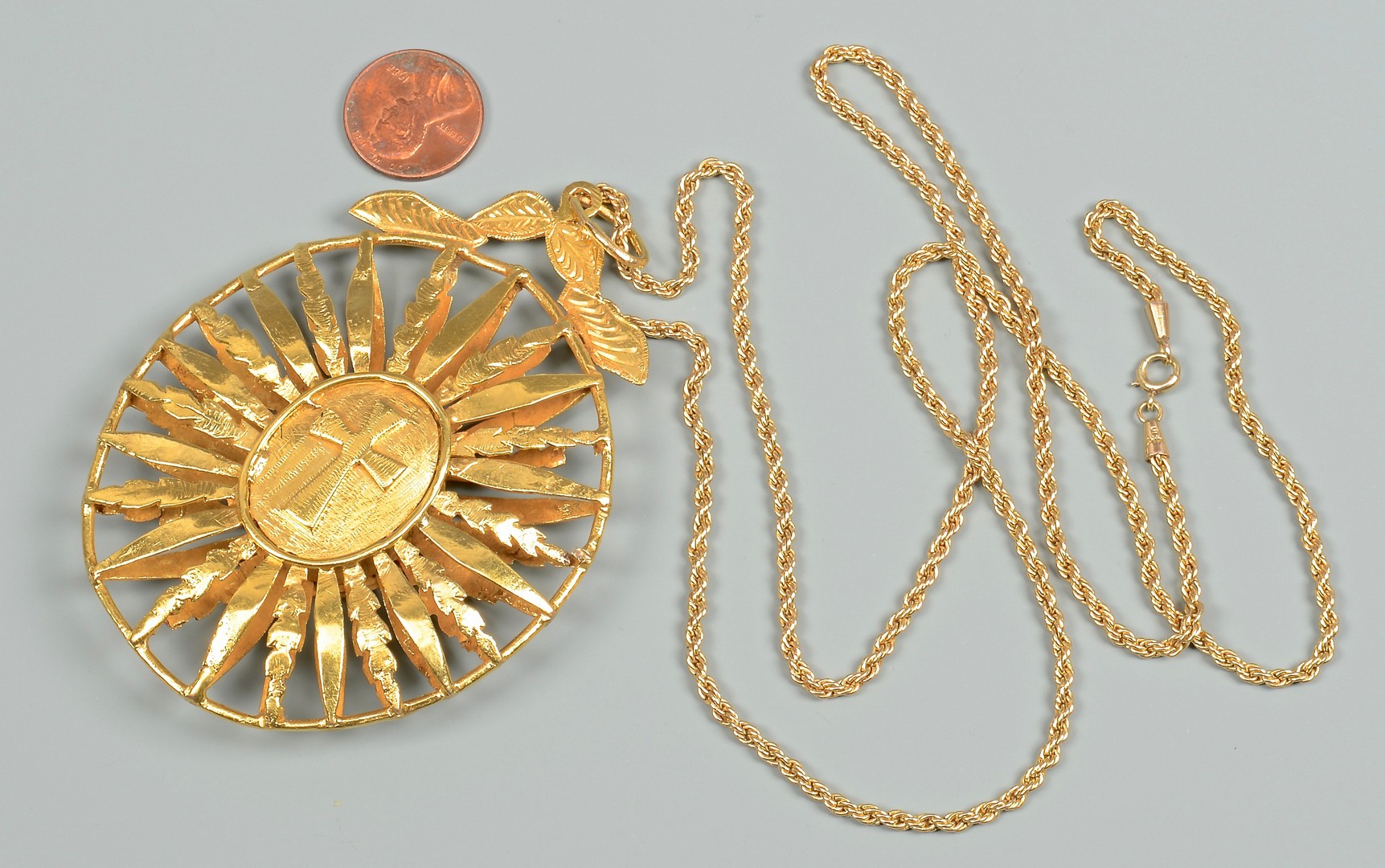 Lot 83: 18K gold Medallion, 14K 31" Necklace