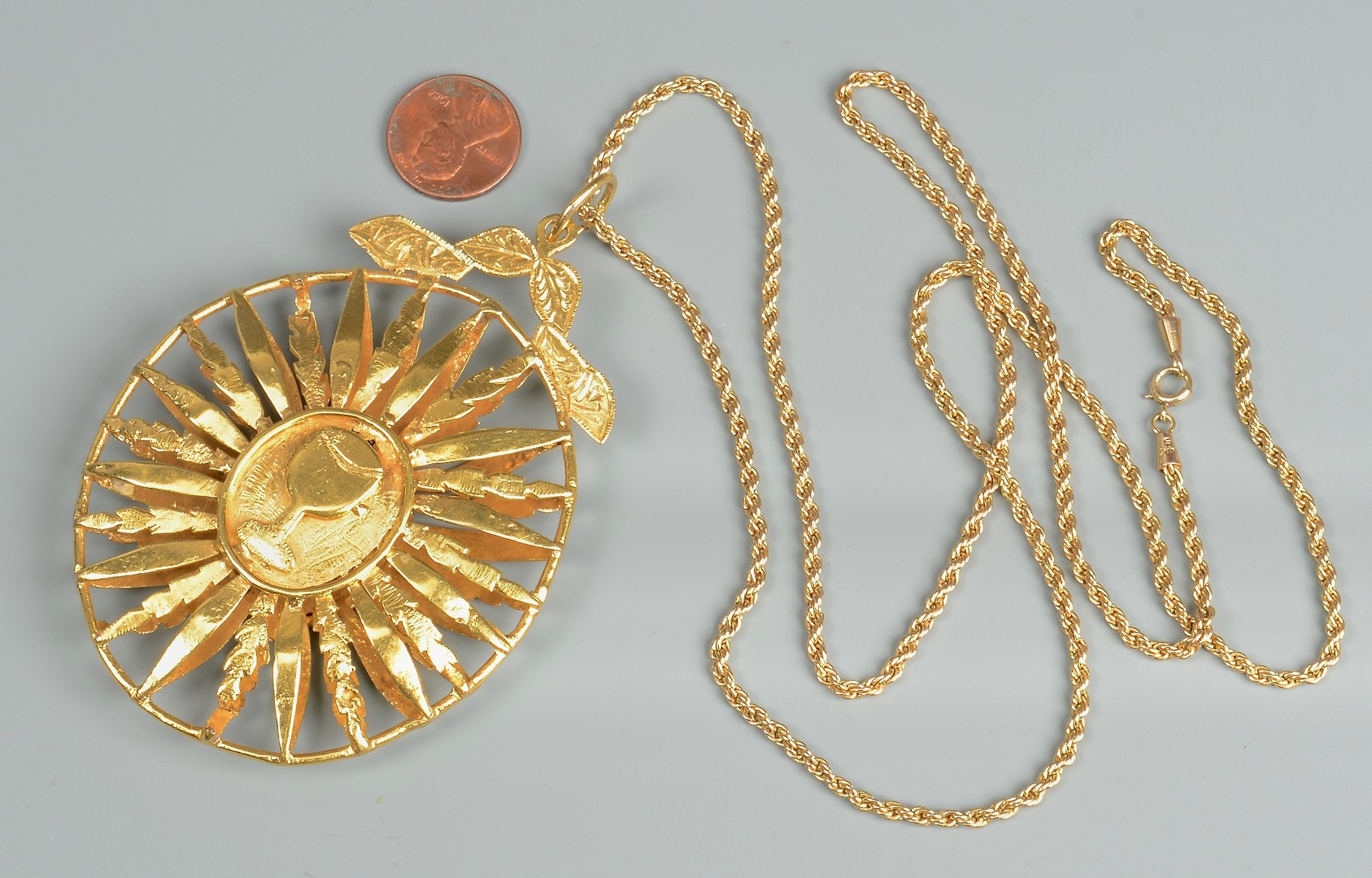 Lot 83: 18K gold Medallion, 14K 31" Necklace