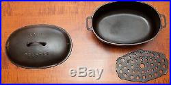 GRISWOLD CAST IRON # 5 OVAL ROASTER WITH LID AND TRIVET