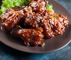 BBQ Korean chicken wings. Indulge in the perfect blend of spicy and savory with our BBQ Korean chicken wings. Try this must-try recipe today and add some heat to your dinner table.#korean #dinner #appetizers #wings