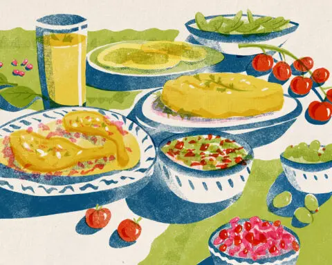 Faded art of foods on decorative plates set out on a table with bright green, red and yellow colors.