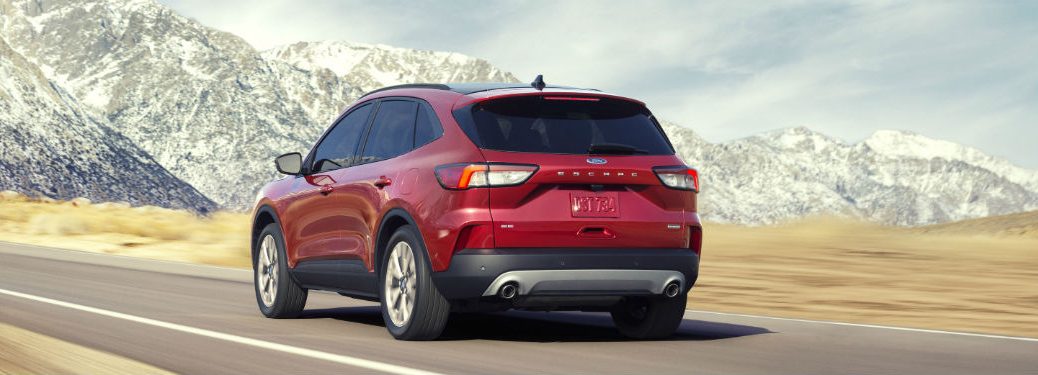 2020 Ford Escape driving down road by mountain scenery