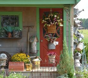 Hang a Collection of Watering Cans to Decorate a Garden Shed