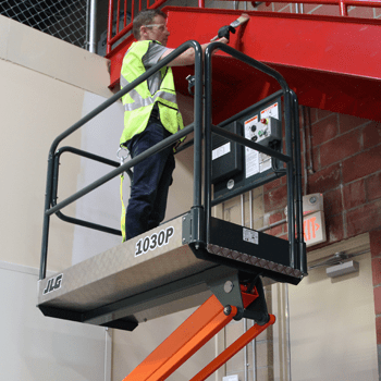 Operator hanging drywall with JLG® EcoLift