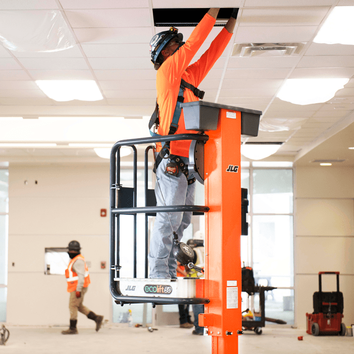 Operator accessing ductwork with JLG® EcoLift