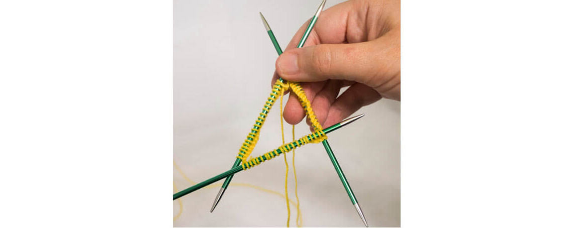 How to knit in the round with double pointed needles?