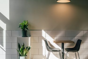 A cafe interior with plants.