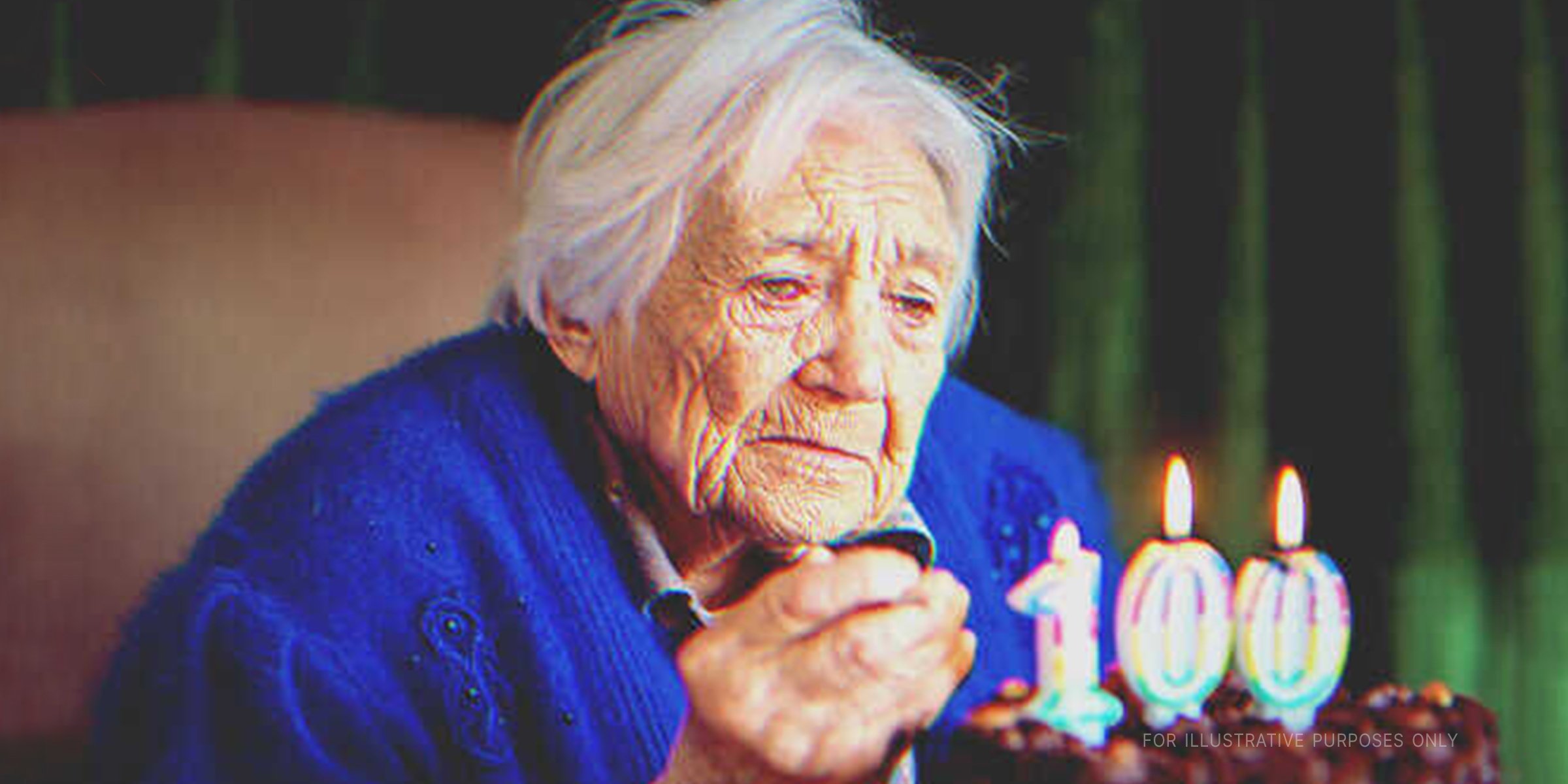 Old lady with her birthday cake. | Source: Getty Images