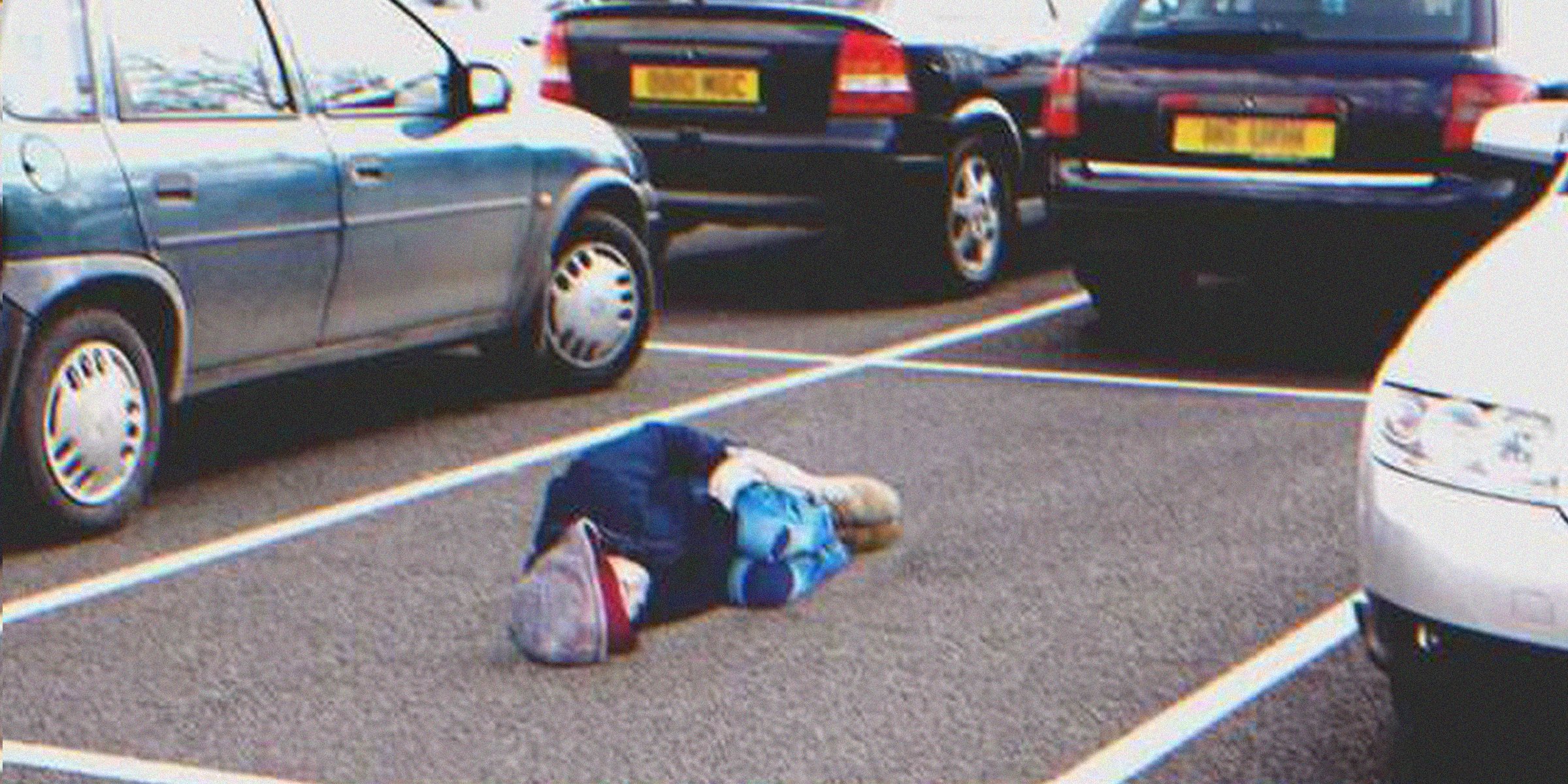 A kid sleeping on a parking lot | Source: Getty Images