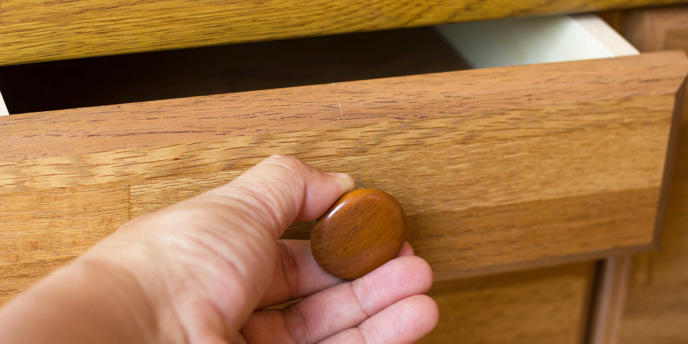 A person opening a drawer | Source: Shutterstock