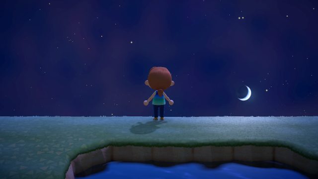 A screenshot from Animal Crossing of a single avatar standing alone at the top of a cliff, silhouetted against the night sky, with no other player or non-player characters present.