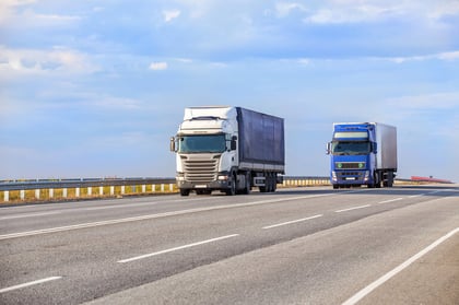 Two big rigs sharing a road