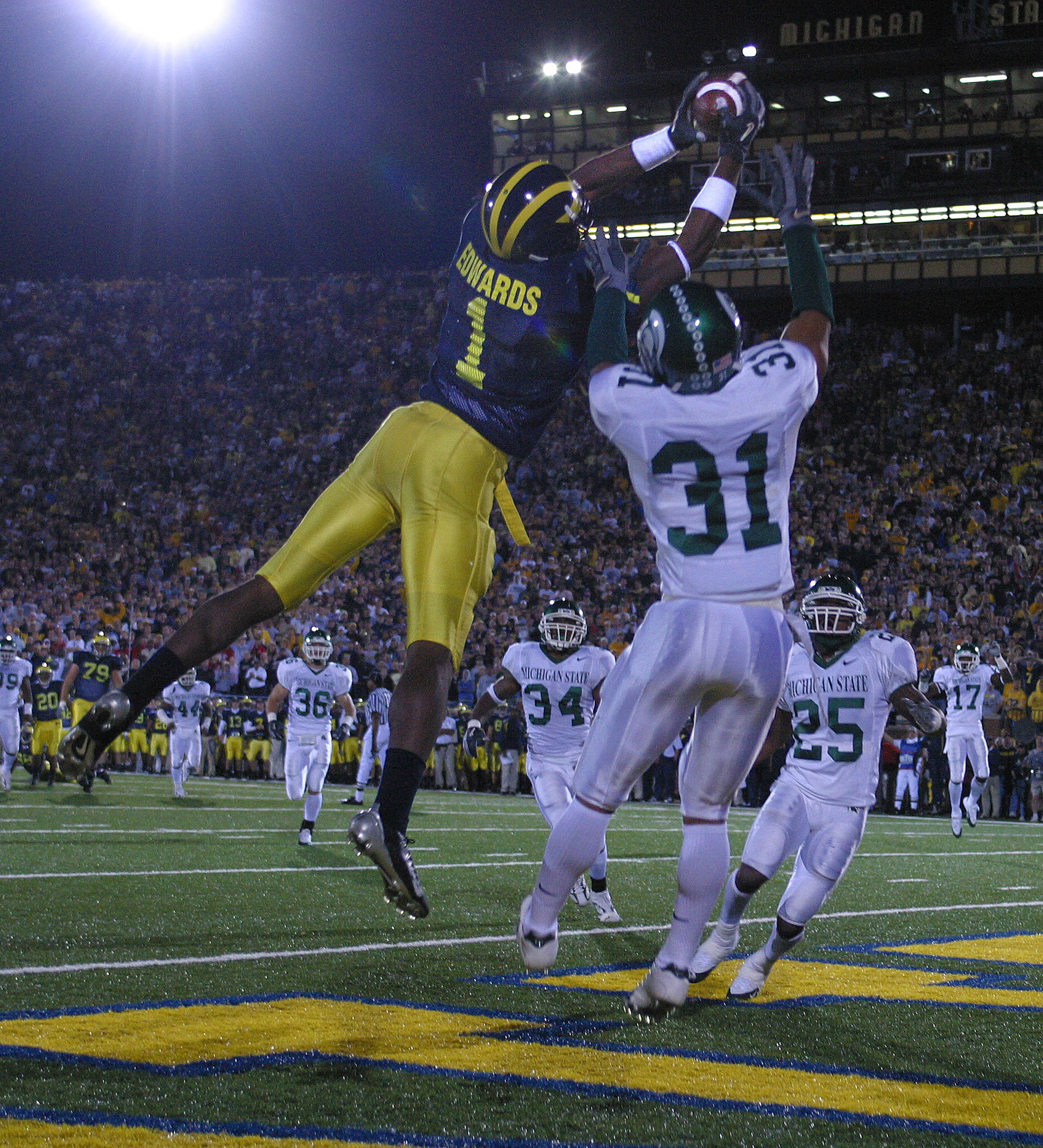 Michigan's Braylon Edwards grabs one of three TD catches in the 2004 overtime classic.classic.