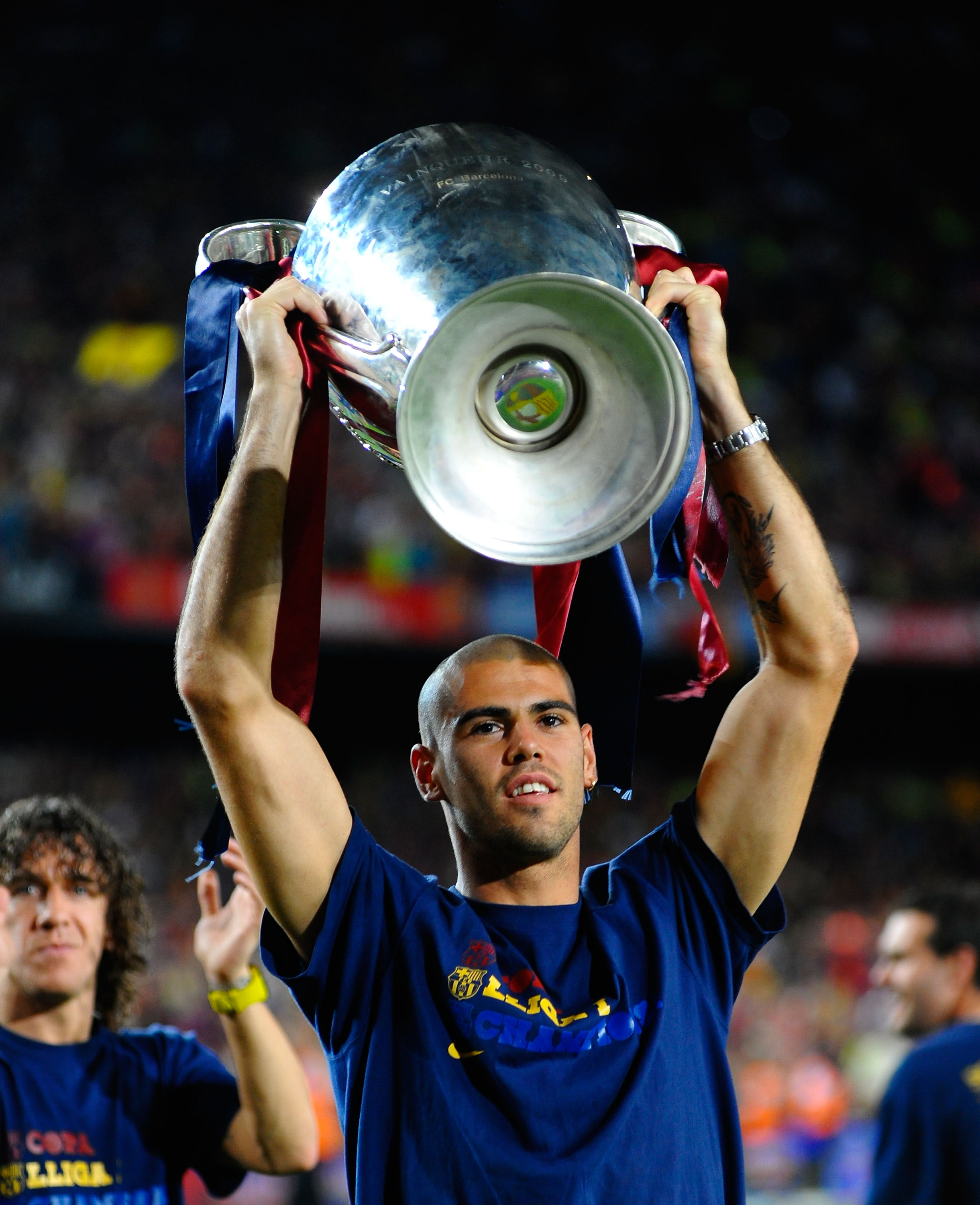 BARCELONA, SPAIN - MAY 28: Victor Valdes holds the UEFA Champions League trophy with Alksander Hleb at the Nou Camp stadium the day after Barcelona won the UEFA Champions League Cup final on May 28, 2009 in Barcelona, Spain. Barcelona beat Manchester Unit