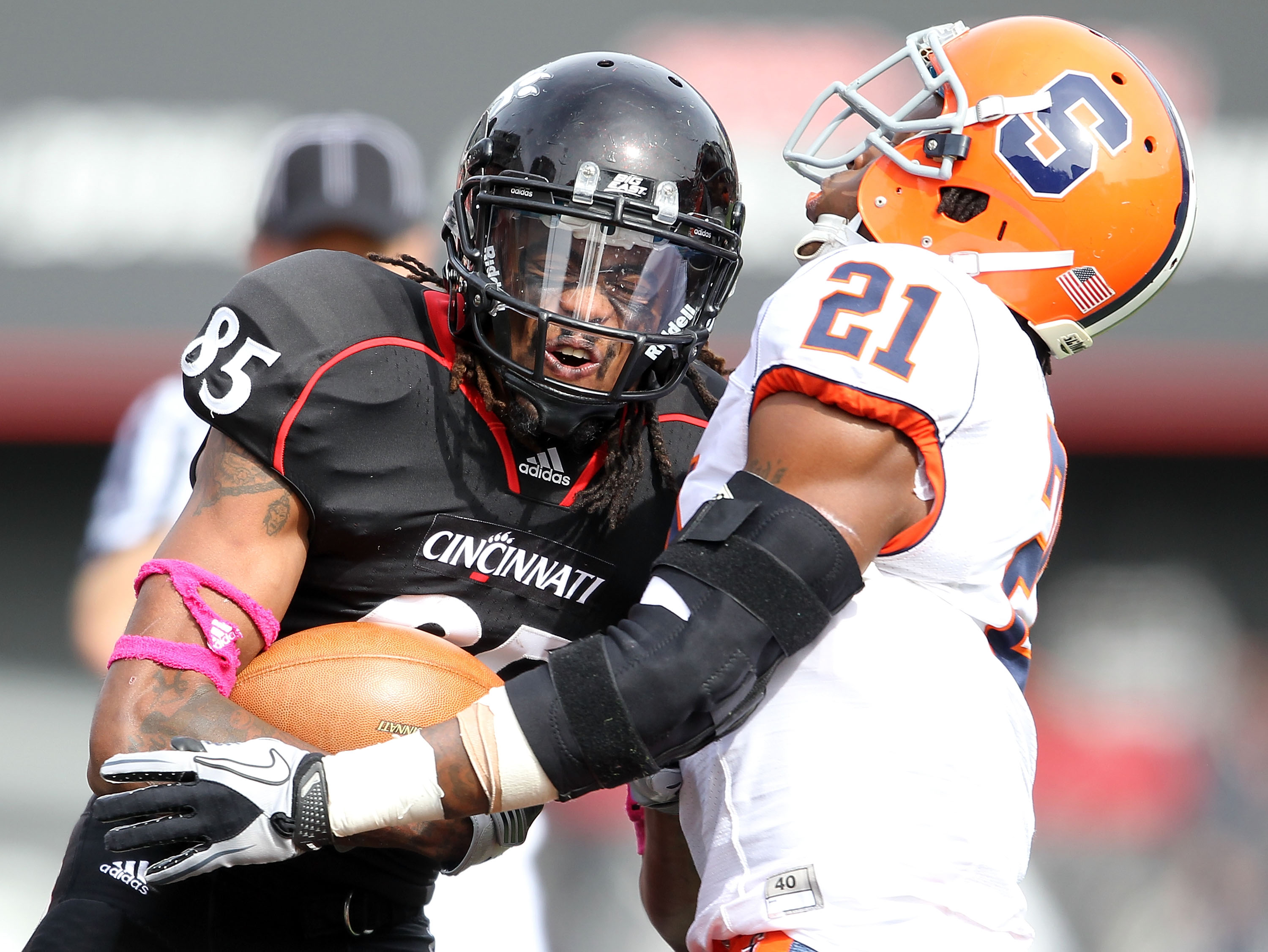 CINCINNATI - OCTOBER 30:  Marcus Barnett #85 of the Cincinnati Bearcats is tackled by Shamarko Thomas #21 of the Syracuse Orange during the Big East Conference game at Nippert Stadium on October 30, 2010 in Cincinnati, Ohio.  (Photo by Andy Lyons/Getty Im